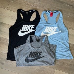 Three Nike workout tank tops size L
